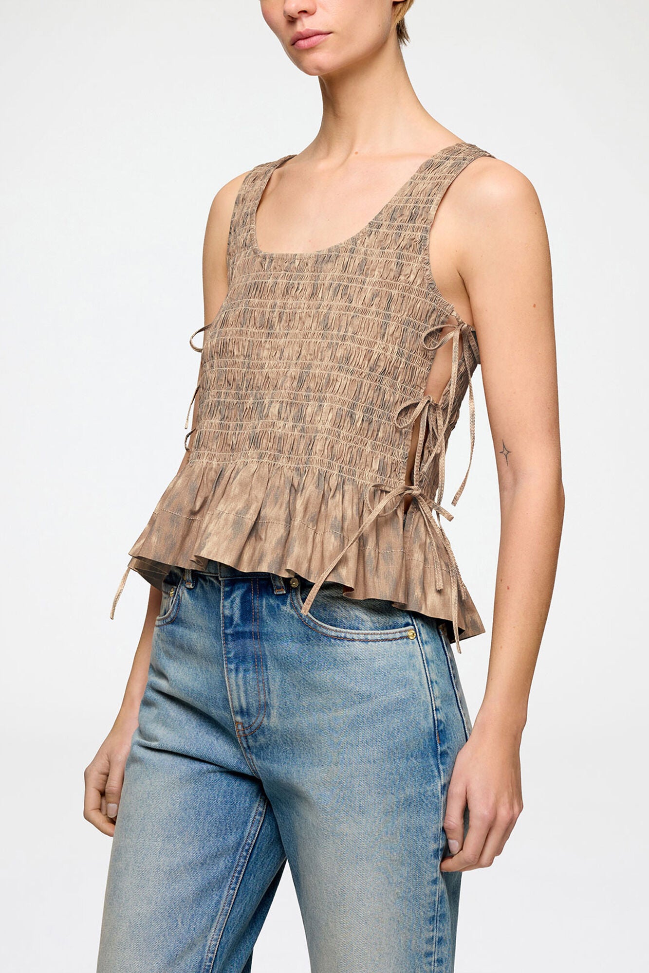 Ganni Printed stretch smocked top