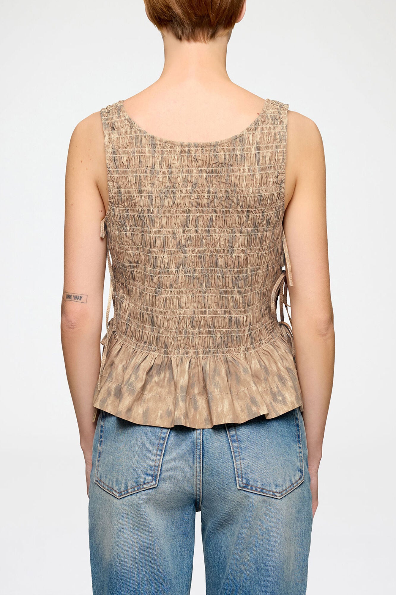 Ganni Printed stretch smocked top